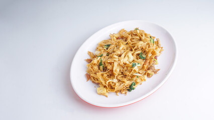 Kwetiau goreng is a Chinese Indonesian stir fried flat rice noodle dish made from kwetiau, which are stir fried in cooking oil with garlic, onion, chicken, and vegetable.