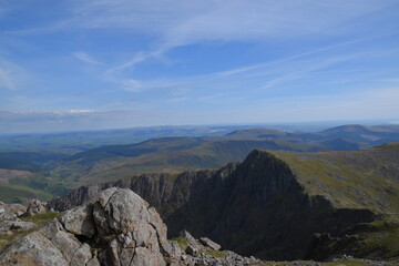 Fototapeta premium a view looing down in the crater of Cadair Idris with a mountain view behind it