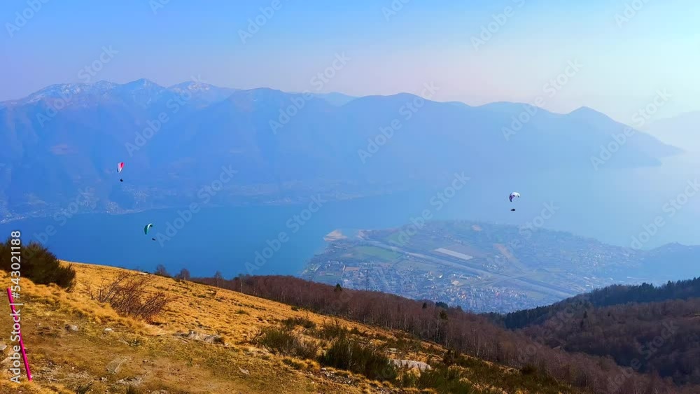 Poster Panorama of Lepontine Alps, Lake Maggiore and flying glider aircrafts from the summit of Cimetta Mount, Ticino, Switzerland