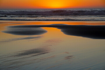 Beautiful sandy beach right after sunset                              