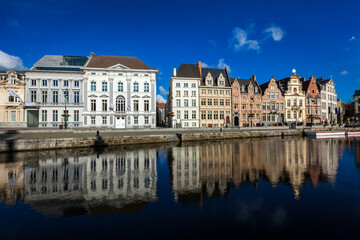 Fototapeta na wymiar Travel Belgium medieval european city town background with canal. Koperlei street, Ghent, Belgium