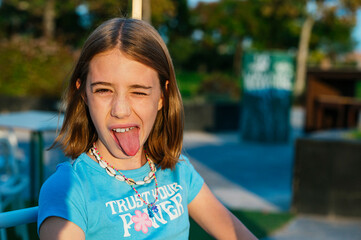 The naughty little girl who shows her tongue.