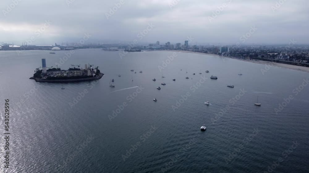 Sticker aerial footage of a big factory surrounded by small ships and boats sailing in the vast ocean