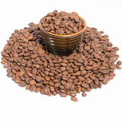 A small saucer with coffee beans stands on a pile of coffee on a white background.