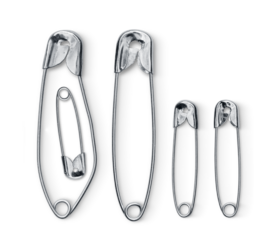 Pregnancy announcement using safety pins isolated on white