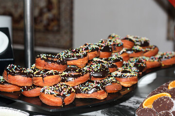 A field of donuts in many different flavors.