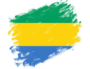 Obraz premium Gabon flag painted on a grunge brush stroke white background