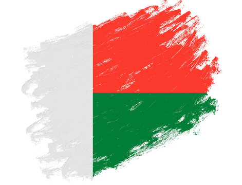 Madagascar flag painted on a grunge brush stroke white background