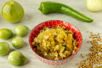 Green (unripe) tomato relish with green pepper, onion and coriander seeds.