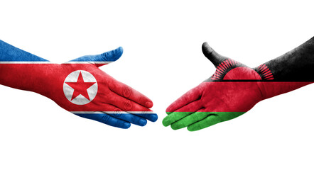 Handshake between Malawi and North Korea flags painted on hands, isolated transparent image.