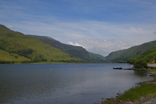 a view of tal-y-llyn lake looking over to the valley in the background