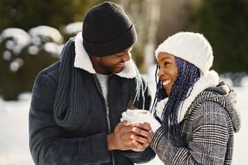 African american couple in a winter forest