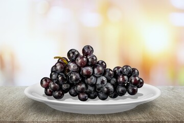 Tasty sweet aroma ripe grapes on a plate