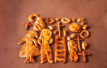 PLATO CON ROSCONES, PASTEL, SUSPIROS, CRUCES Y FIGURAS DE MASAPAN POR TRADICIÓN DE  TODOS SANTOS EN BOLIVIA