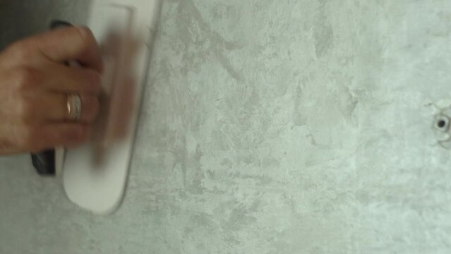 Worker Applying Decorative Concrete Plaster