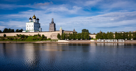 Cityscape of Pskov, Russia. Panorama of the Pskov Kremlin, Trinity Cathedral and the letters "Russia begins here"