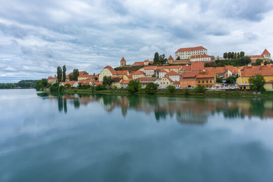 Panoramic of Ptuj city with the Drava river in front of the picture with its reflection in Slovenia.