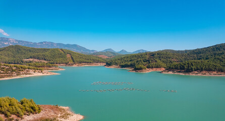 Fototapeta na wymiar Fish farm for breeding cages for trout and salmon. Concept aquaculture industry Turkey, Norway, aerial top view