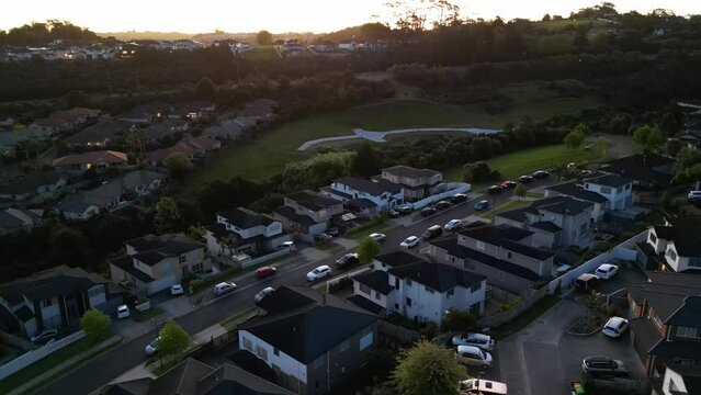 Drone shot of Devonport with the sea view at sunrise, cloudy sky background, Auckland, New Zealand