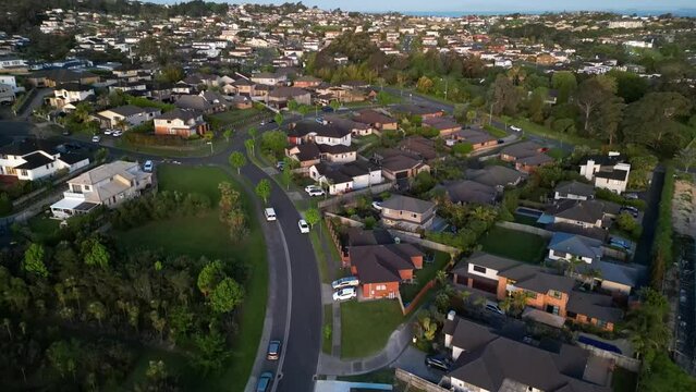 Drone shot of Devonport with the sea view at sunrise, cloudy sky background, Auckland, New Zealand