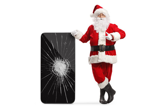 Santa claus pointing at a smartphone with cracked screen
