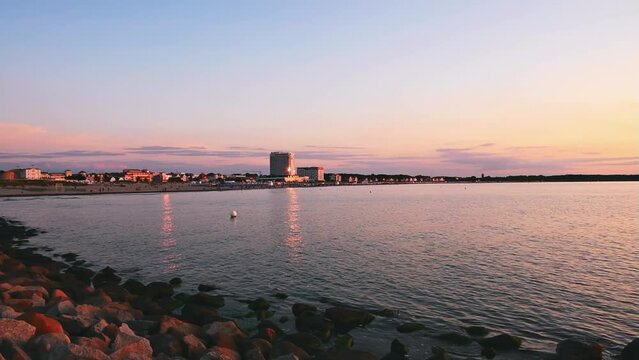 A panoramic view over Warnem&uuml;nde Beach in Mecklenburg-West Pomerania (Germany) and the Baltic Sea at sunset - AUGUST 02 2021.