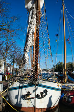 Bow, bowsprit and safety net of a classic Dutch sailing clipper in the harbour of Zwartsluis, the Netherlands

