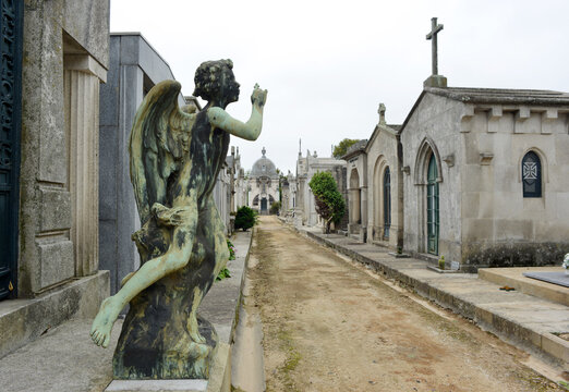 Porto, cementery architecture and angel sculpture view to old grave monuments
