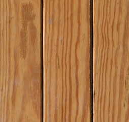 Fondo con detalle y textura de varios listones de madera con vetas y nudos, en suaves tonos marrones