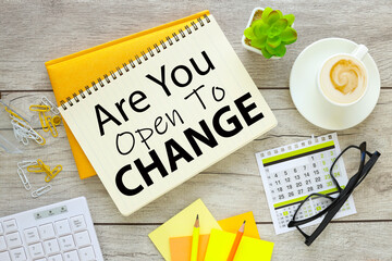are you open to change. two notepads with text. near bright stationery