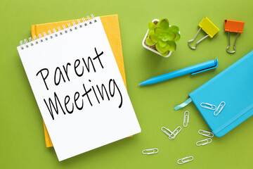 Meet Parents green background.notepad with text in calendar. Close-up