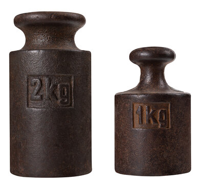 Metal one and two kilogram weights for an old analog scale on an isolated background.