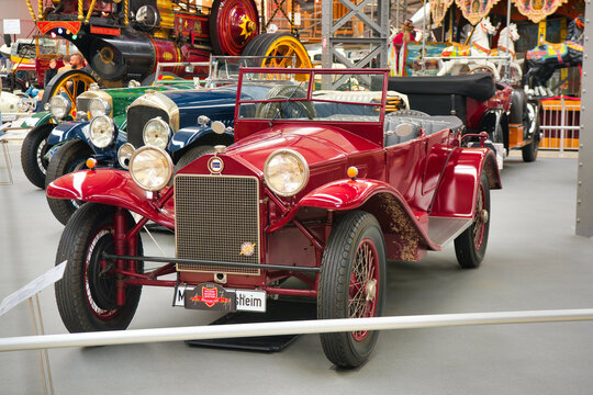 SPEYER, GERMANY - OCTOBER 2022: red maroon LANCIA LAMBDA 1926 cabrio roadster retro car in the Technikmuseum Speyer