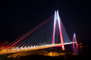 Fototapeta na wymiar Yavuz Sultan Selim Bridge night exposure, İstanbul, Turkey. Yavuz Sultan Selim Bridge in Istanbul, Turkey. 3rd Bosphorus Bridge and Northern Marmara Motorway.