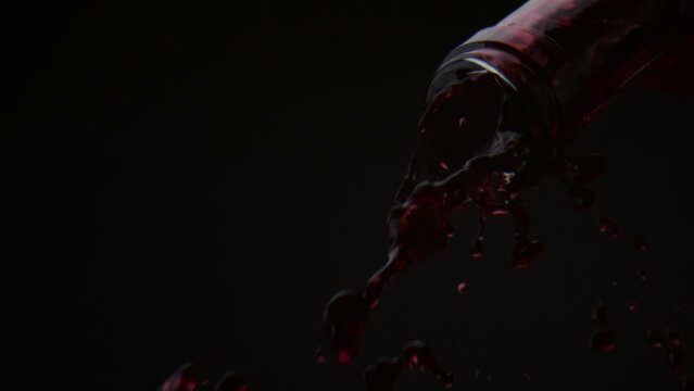 Red Wine Flowing Bottle In Super Slow Motion Closeup. Alcohol Drink Falling Down