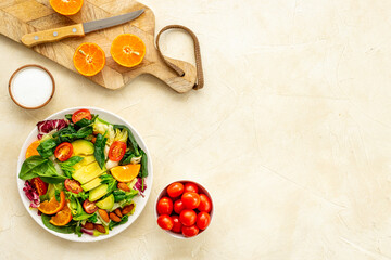 Healthy vegetarian bowl - green salad with avocado and tomatoes