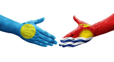 Handshake between Kiribati and Palau flags painted on hands, isolated transparent image.