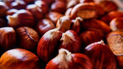 chestnuts  on the blurred brown background, selective focus.