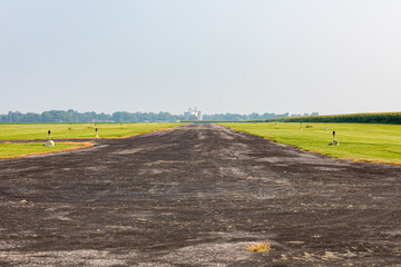 Airstrip runway of private rural airport. Aviation safety and maintenance problems concept.
