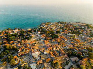 Aerial top view of Side, a resort town, in Antalya Province, Turkey, surrounded by the Mediterranean Sea. The roofs of the buildings, turquoise sea water. High quality photo