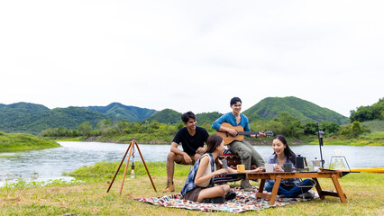 Group of Asian people enjoy and fun outdoor lifestyle hiking and camping together on summer travel...
