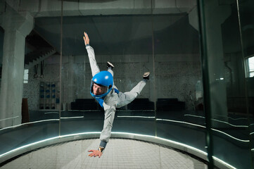 A woman flies in a wind tunnel. Free fall simulator.
