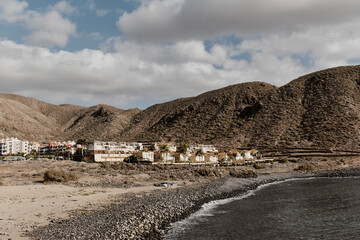 Landscape with village and mountains on the island. 