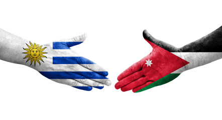 Handshake between Jordan and Uruguay flags painted on hands, isolated transparent image.