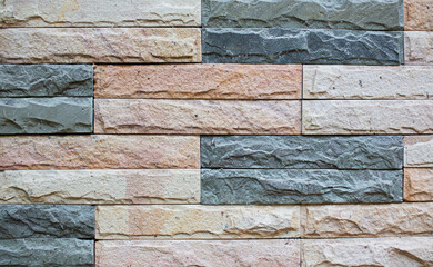brick block pattern of gray and rough sandstone wall texture and background