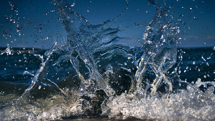 Waves crash on the north shore rocks of long island new york