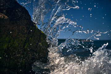 Waves crash on the north shore rocks of long island new york