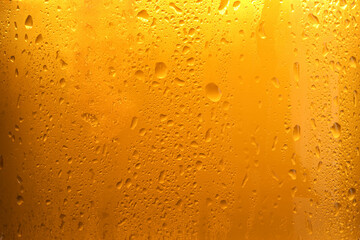 Glass of tasty cold beer with condensation drops as background, closeup - obrazy, fototapety, plakaty