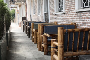 Fototapeta na wymiar Kutaisi, Georgia - September 2, 2022: Beautiful wooden furniture near building outdoors
