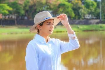 Agribusiness woman wearing hat and jeans at the end of a working day..